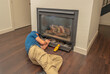 © spatesphoto - Service technician working on a fireplace
