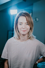 Poster - Vertical shot of a smiling young caucasian blonde female