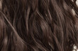 © Sixsmith - closeup of multiple pieces of clip in wavy brown synthetic hair extensions