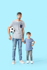 Sticker - Father and little son with soccer balls on color background