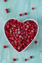 Sticker - frozen red currants on wooden surface