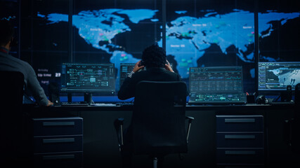 Aufkleber - Diverse Multiethnic IT Technical Support Manager with Curved Hair Puts on Headphones. Monitoring Control Room Office with Big Digital Screens with Server Technical Blockchain Data.