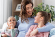 © Syda Productions - people, family and love concept - happy smiling mother with two daughters at home