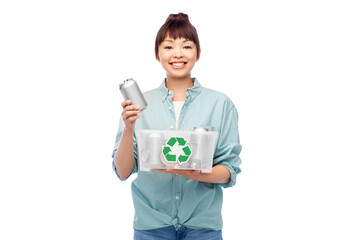 Sticker - metal recycling, waste sorting and sustainability concept - smiling young asian woman holding plastic box with tin cans over white background