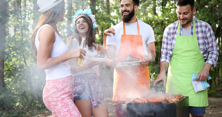 Wall Mural - Friends having a barbecue party in nature