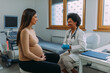 Pregnant woman during examination at doctor office