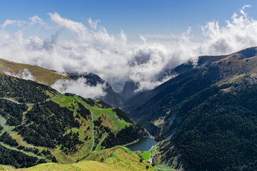 Wall Mural - Beautiful view from above the clouds of a valley