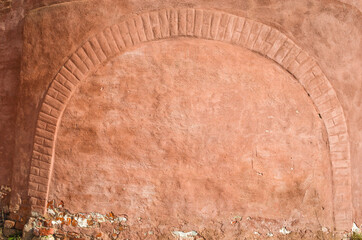 red wall background, closeup photo of grunge red wall with brick arch of saint euthymius monastery i