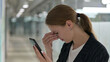 © stockbakers - Young Businesswoman having Loss on Smartphone