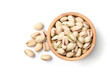 Flat lay of pistachio nuts in wooden bowl isolated on a white background. Clipping path.