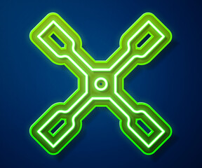 Poster - Glowing neon line Wheel wrench icon isolated on blue background. Wheel brace. Vector