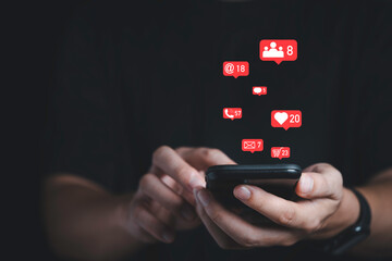 Man holding smartphone with Social media and business icons , technology and marketing concept.