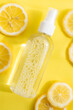 Antiseptic and lemons on a yellow background . Antiseptic for hands.