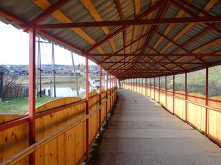 Pedestrian gallery leading to the suspension bridge over the Tura. Verkhoturye. Sverdlovsk region. Russia