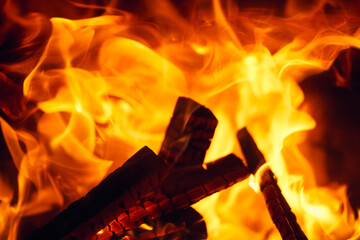 A fire burns in a fireplace, Fire to keep warm. Logs burning in a fireplace