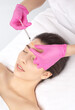 © Dimid - Cosmetologist makes rejuvenating anti wrinkle injections on the face of a beautiful woman. Female aesthetic cosmetology in a beauty salon.