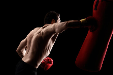 Poster - Topless man hitting a punching bag