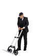 © fellpon - A happy businessman using a wheelbarrow isolated white.