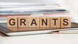 the word grants is written on wooden cubes, concept