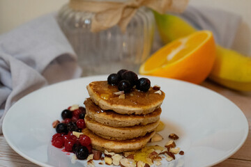 Poster - Appetizing breakfast with fresh pancakes with syrup and blueberry