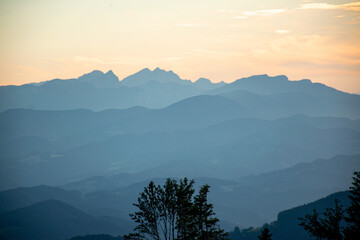 Poster - Beautiful sunset over mountains with storm clouds in the background