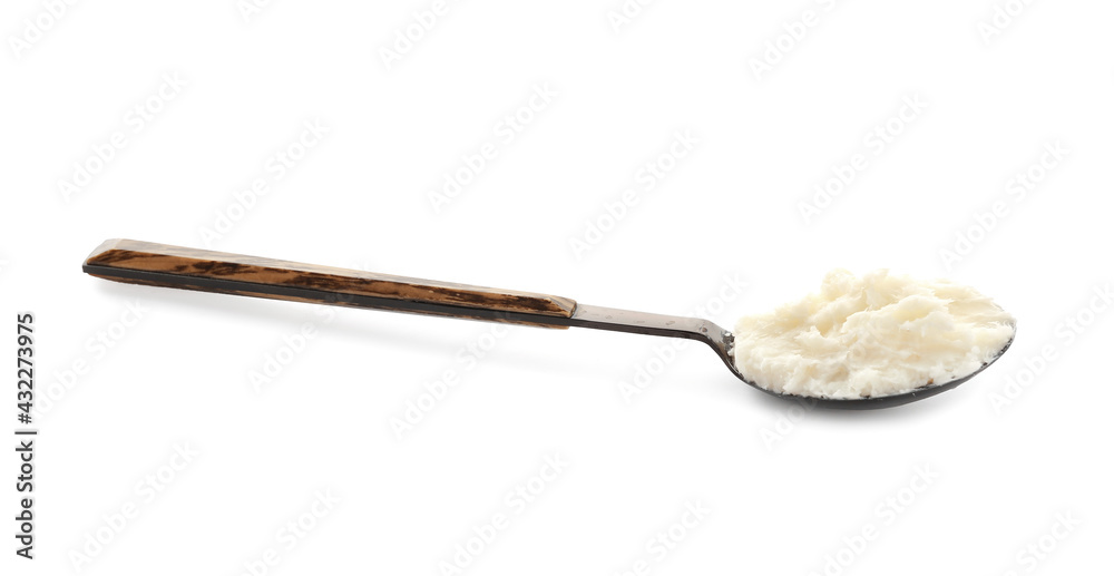 Spoon with shea butter on white background