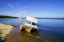 Small Pleasure Motor Boat Wrecked And Stranded On The Beach