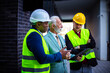 © liderina - The construction site boss has a conversation with the architects. Focus is on background.