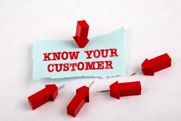 Wall Mural - KNOW YOUR CUSTOMER. Note sheet and red arrows on white paper
