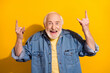 Photo of hooray nice grey beard old man show rock sign wear blue shirt isolated on vivid orange color background