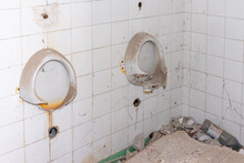 Broken Toilets Inside A Abandoned Building. Dirty Toilet