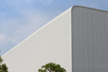 new white metal factory with ble sky background. large metal cargo.