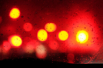Canvas Print - close up of rain droplet with red light