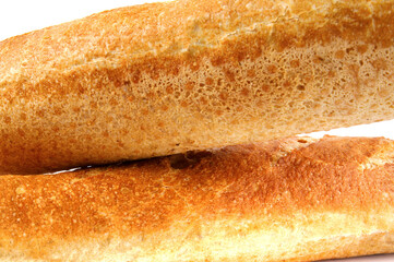 Two baguettes on a white background. French baguette.