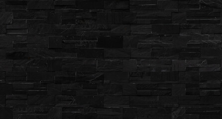 seamless black brick wall texture for background.