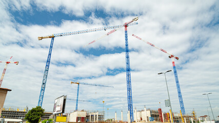 Big construction site with many cranes to build a new residential district in Milan, Italy, with several homes, named 