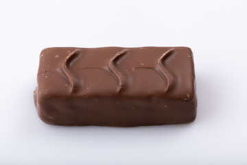 Milk chocolate bar on a white background