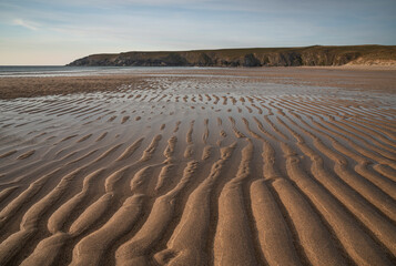 Wall Mural - absolutely beautiful landscape images of holywell bay beach in cornwall uk during golden hojur sunse