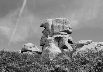 Pere Trebeurden (Father Trebeurden)  - unusual granite rock in shape of male head at Pink Granite Coast near Trebeurden. Brittany, France. Guard of the land. Black white historic photo.