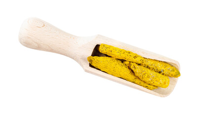 Wall Mural - dried roots of turmeric in wooden scoop cutout