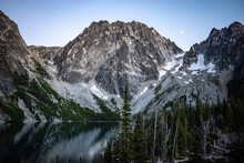 A Mountain Reflection In An Alpine Lakes In The Cascade Mountains At Dusk