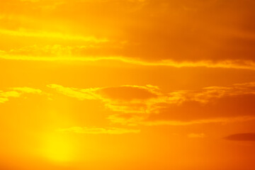 Golden sky with clouds at sunset