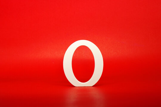 O white letter word wooden Isolated Red Background with Copy Space - Advertise object symbol business competition Concept 