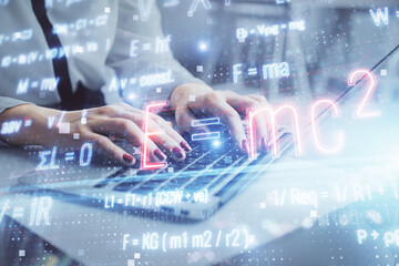 Poster - Double exposure of woman hands typing on computer and formula hologram drawing. Education concept.