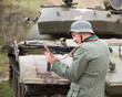 © aleks - Man in uniform German soldier WW II with a gun Schmeisser
