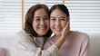 © ChayTee - Close up attractive beautiful two asia people face cheek smile to camera authentic real family mum and adult kid in woman power day, diverse ethnic people, genes genetics ginger mom skincare concept.