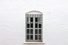 Vintage Metal Grid Window White Brick Building Wall