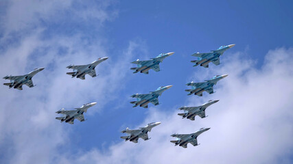 Wall Mural - MOSCOW, RUSSIA - MAY 7, 2021: Avia parade in Moscow. su-35 and su-34 and su-30 in the sky on parade of Victory in World War II in Moscow, Russia