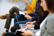 © maxbelchenko - Young audience sitting in a row and making notes while listening to presentation at conference hall. Business group meeting seminar training concept. Planning, analysis, collaborate work in teamwork.