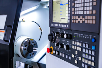 Front view on cnc milling machine control panel with display